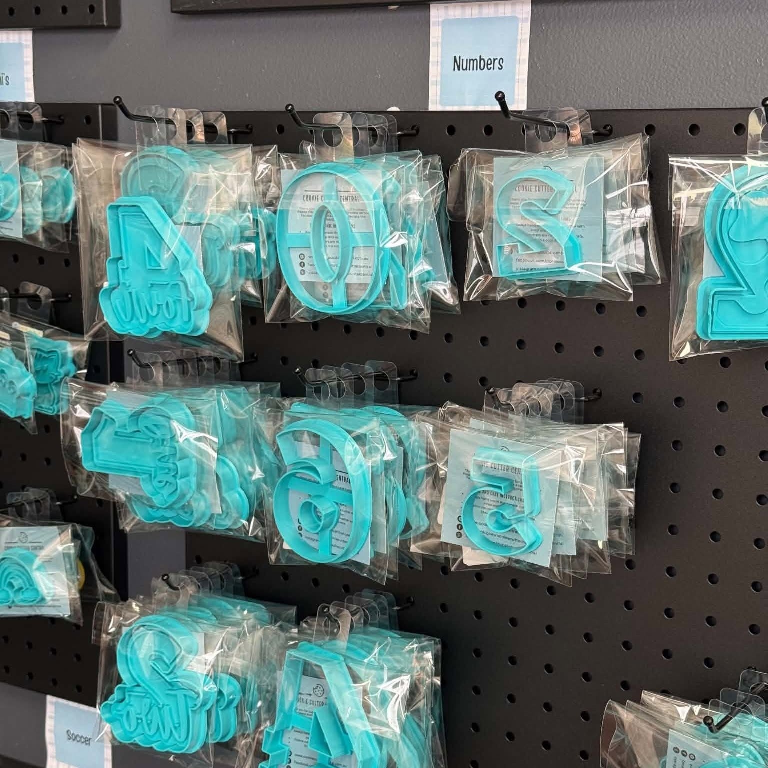 Packaged number cookie cutters on the number display in our Morwell shop